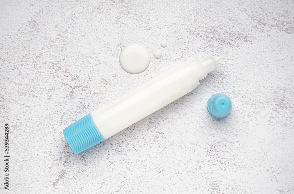 Naklejka premium Stationery glue on light background