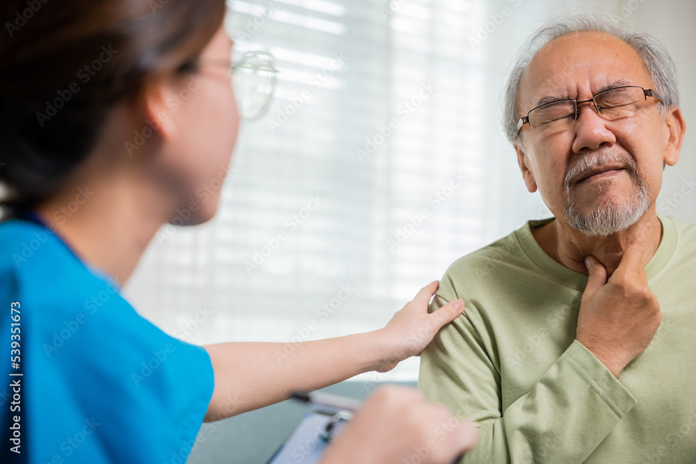 Obraz premium Doctor woman examines lymph nodes on elderly neck to determine if swollen, sore throat, Asian young nurse checking senior old man neck pain in clinic at retirement home, physical therapist