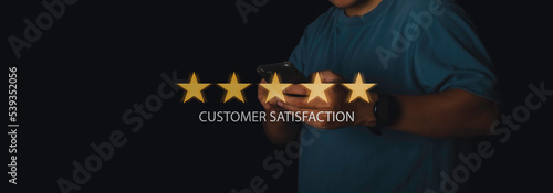 Businessman giving high score with five golden stars rating satisfaction in service.