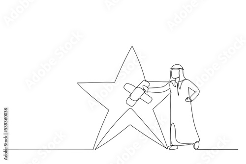 Drawing of arab businessman fix broken rating star with bandage. Metaphor for reputation management. Single continuous line art style photo