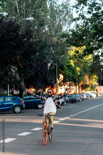 Cheerful Man Riding his Bike © santypan