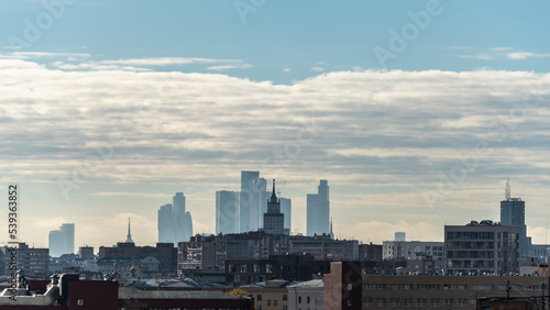 Wide Moscow cityscape with Ukraine hotel and Moscow City Business Center in morning fog.