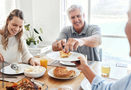 Family, food and lunch with a senior man sharing a meal with his daughter in the dining room of their home during a visit. Retirement, love and eating with an elderly male pensioner and relatives