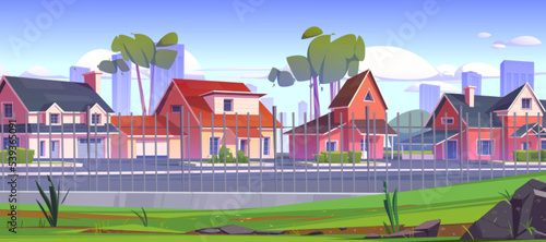 Suburban street with houses and road behind metal fence. Summer landscape of city suburb with cottages with garages, trees, green grass and town skyscrapers on horizon, vector cartoon illustration
