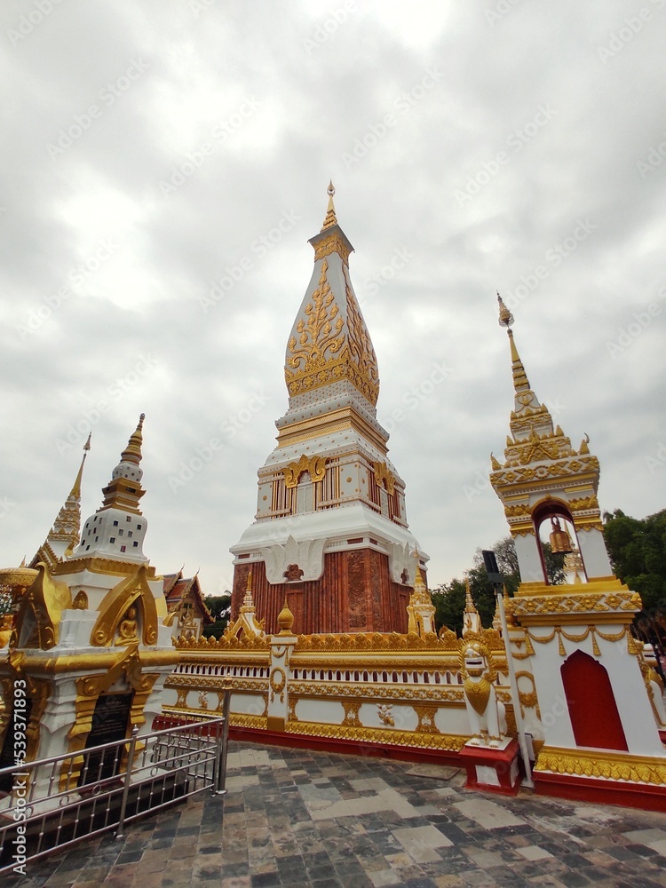 Obraz premium Wide angle of Phra That Phanom and the second wall inside Wat Phra That Phanom. This temple is a popular destination for those born in the year of the Monkey.