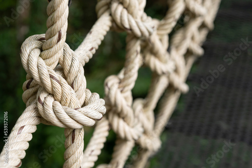 rope braided with a rope net on texture background © Thiradech