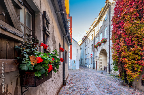 Autumn in narrow medieval street in old European town