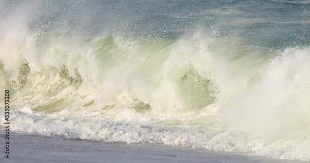 powerful and dangerous shorebreak waves close up shot in slow motion powerful and dangerous shorebreak waves close up shot in slow motion