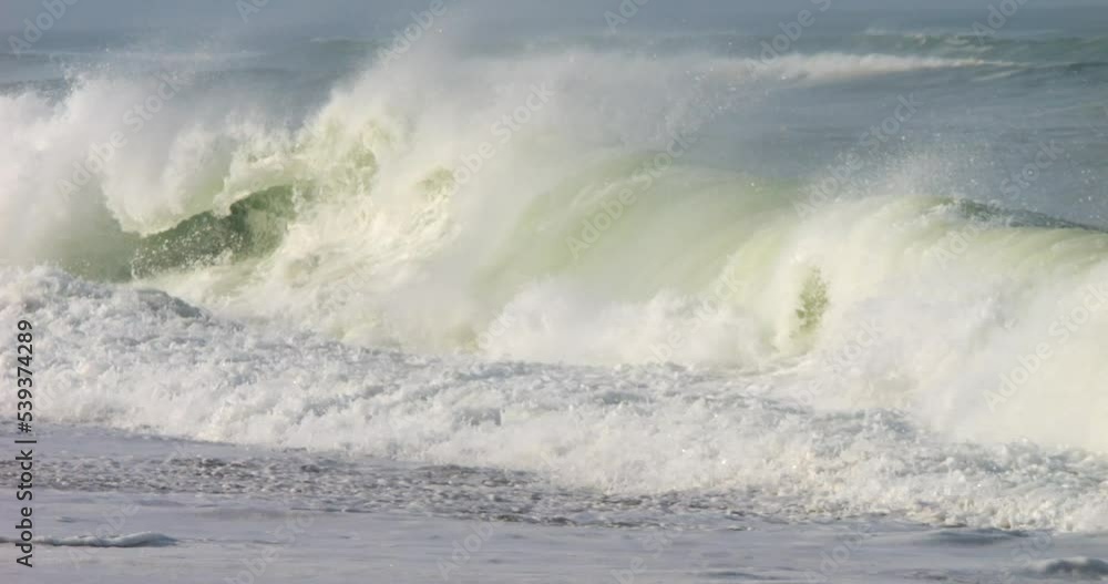powerful and dangerous shorebreak waves close up shot in slow motion powerful and dangerous shorebreak waves close up shot in slow motion