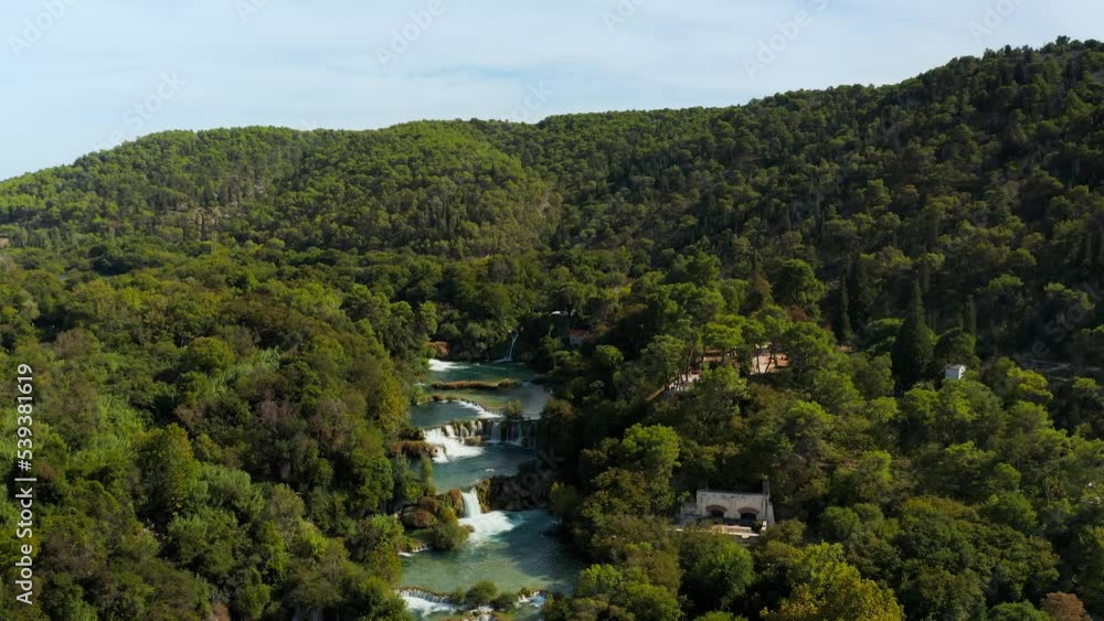 Aerial view over the amazing waterfalls at Krka National Park in Croatia, Located along the middle-lower course of the Krka River. It is a large park that includes the entire area of the Krka River. T Aerial view over the amazing waterfalls at Krka National Park in Croatia, Located along the middle-lower course of the Krka River. It is a large park that includes the entire area of the Krka River. T