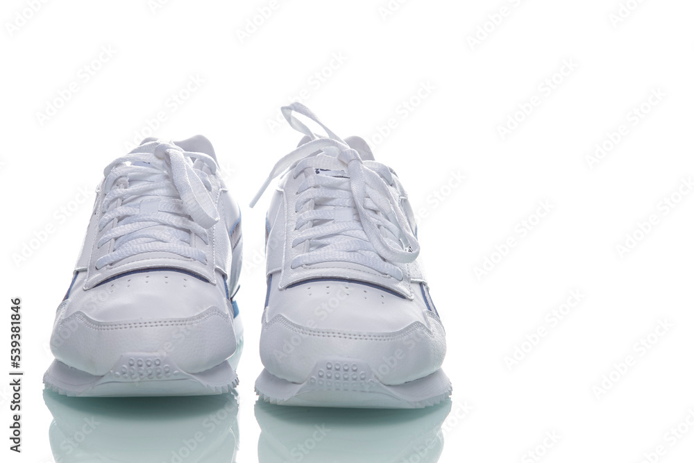 Pair of of New White Sneakers Placed Against White Background. Pair of of New White Sneakers Placed Against White Background.