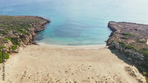 Turquoise Water Of Calamosche Beach In Vendicari Natural Reserve In Sicily, Italy - aerial pullback photo