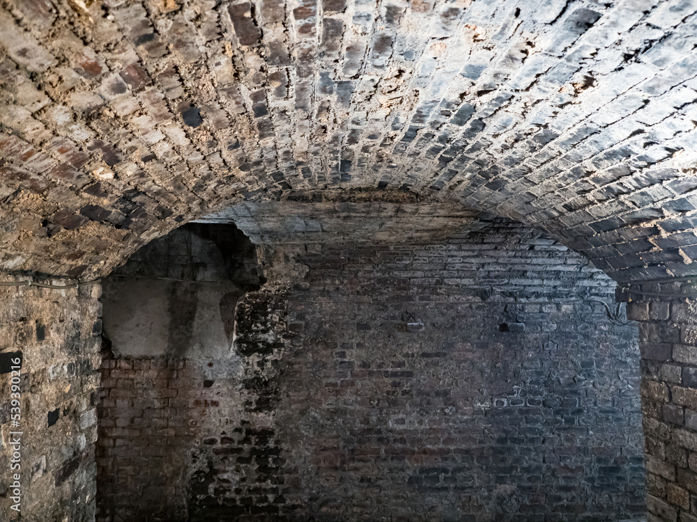 Ruined brick underground tunnel or corridor