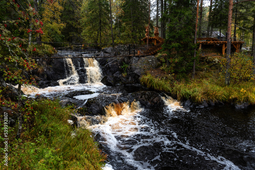 Fototapeta Naklejka Na Ścianę i Meble -  Picturesque waterfall in Ruskeala in autumn, Karelia, Russia