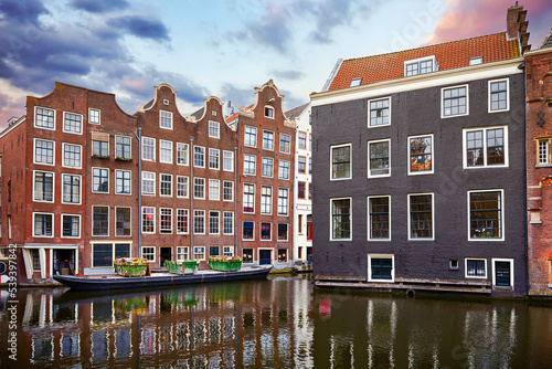 Photography Red-light district in Amsterdam city picturesque landscape panorama evening town with pink sunset sky