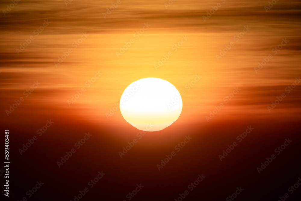 The sun is rising in the dark environment for any hopeful concept background. It’s shot at Thailand in January 2022.