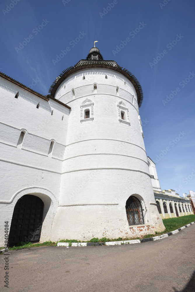 round tower of the Rostov Kremlin against the blue sky, summer sunny day