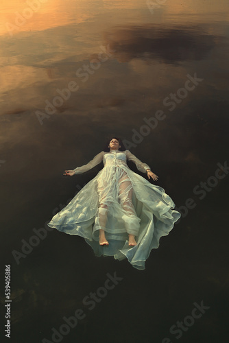Dead bride floating in dark lake waters