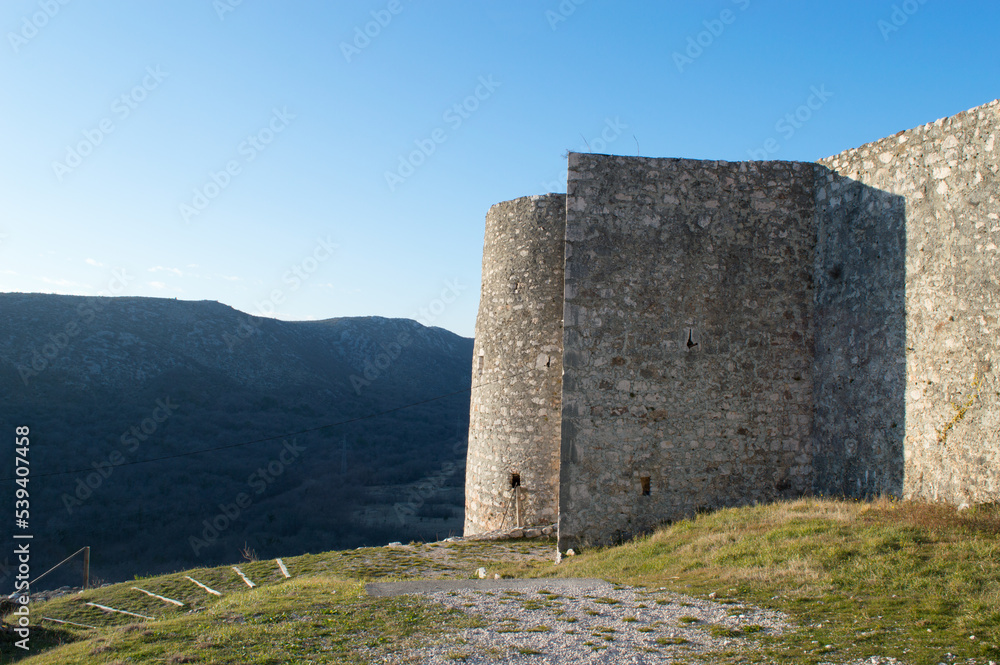 Medieval stone castle surrounded with forested mountains in Drivenik, Croatia