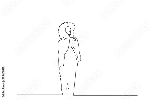 standing curly hair woman standing calm and confident posing with her bag