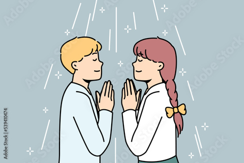 Boy, girl pray facing each other in church or at home. Children talk to God with prayers with palms together. Orthodox, catholic or protestant religion, faith, spirituality. Vector linear concept.
