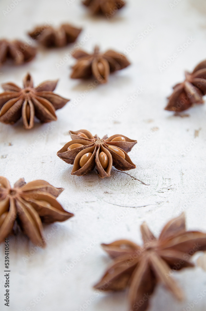 Anise stars on wooden surface