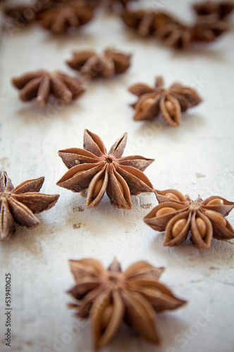 Anise stars on wooden surface