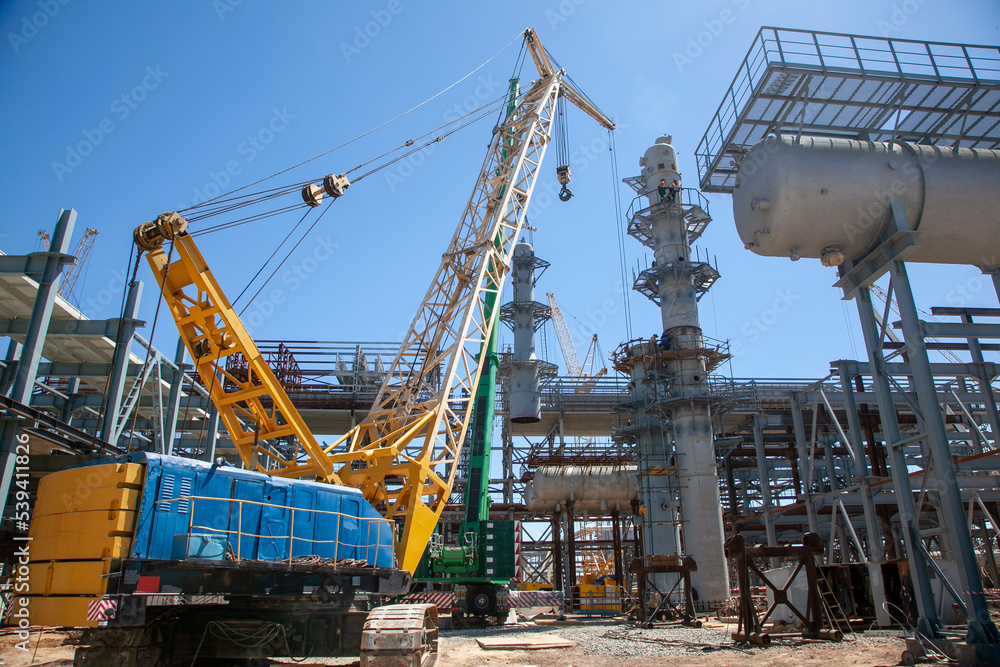 Construction of an oil refinery, the general plan on the street. The plant produces gasoline, oils and other refined products. Construction of an oil refinery, the general plan on the street. The plant produces gasoline, oils and other refined products.