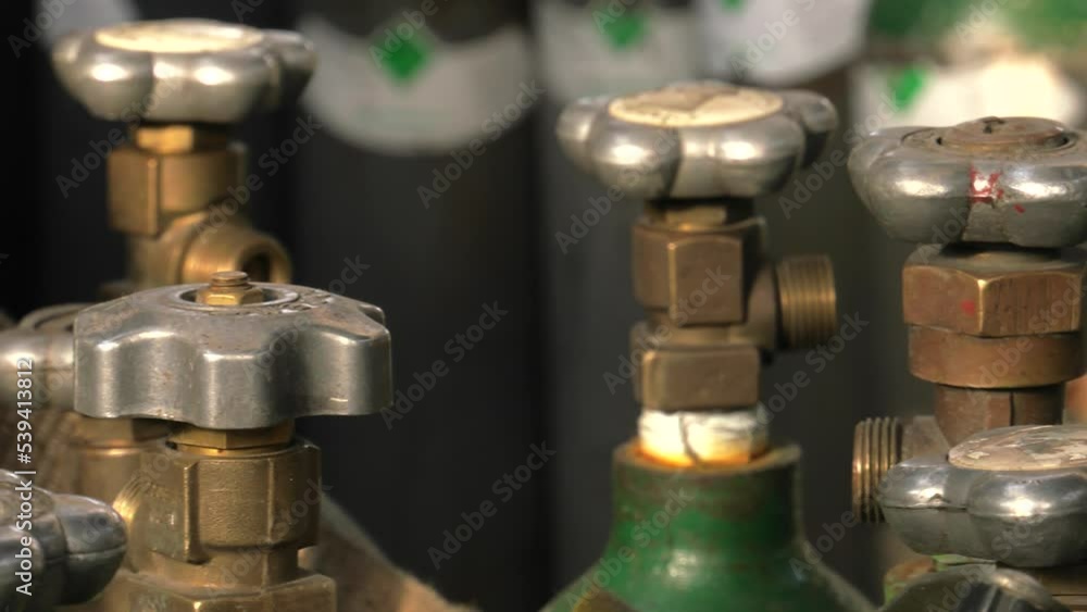 Cylinder valve. Gas bottling plant. 4K, UHD, 50p, Panning,Close-up, Cylinder valve. Gas bottling plant. 4K, UHD, 50p, Panning,Close-up,