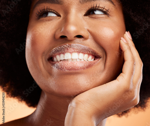 Obraz na plátně Black woman, lip sugar makeup or skincare health of exfoliate model with smile on orange studio background