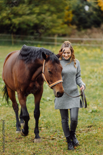 Woman on a horse at rancho. Horse riding, hobby time. Concept of animals and human