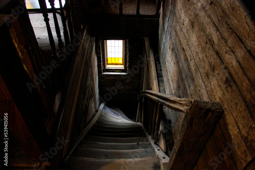 Old abandoned building staircase with a window