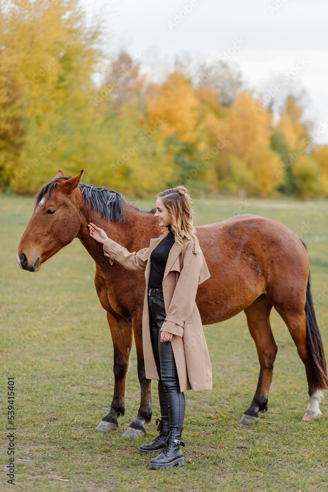 Woman on a horse at rancho. Horse riding, hobby time. Concept of animals and human Woman on a horse at rancho. Horse riding, hobby time. Concept of animals and human