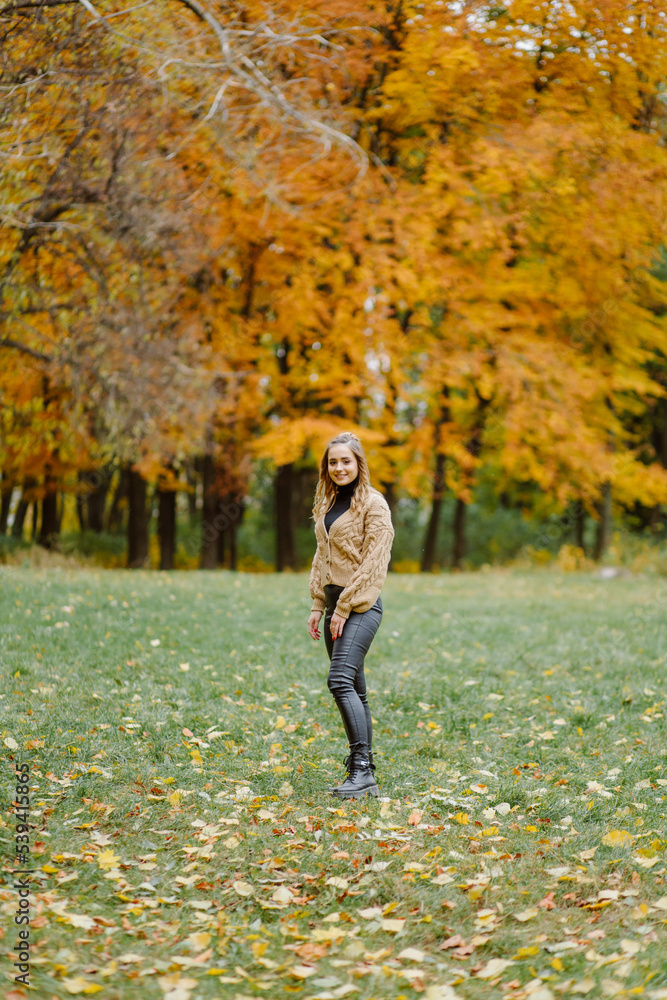 Woman walking in the autumn park, a healthy lifestyle, walk, exercise Woman walking in the autumn park, a healthy lifestyle, walk, exercise