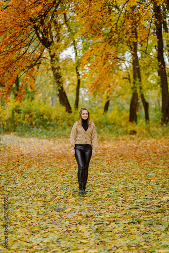 Woman walking in the autumn park, a healthy lifestyle, walk, exercise © andriyyavor
