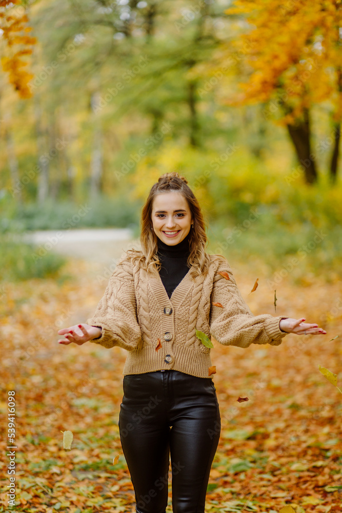 Woman walking in the autumn park, a healthy lifestyle, walk, exercise Woman walking in the autumn park, a healthy lifestyle, walk, exercise