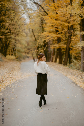 Woman walking in the autumn park, a healthy lifestyle, walk, exercise © andriyyavor