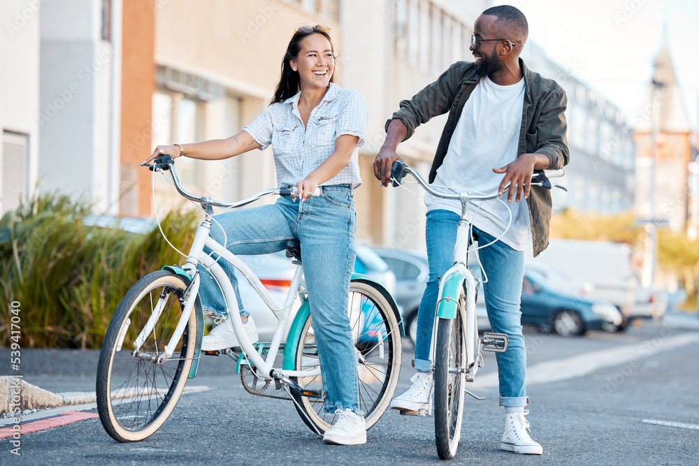 Obraz premium Bike, young couple and city street cycling in summer for eco friendly carbon footprint, love date and relax. Happy man, smile woman and diversity friends retro bicycle for sustainable urban adventure