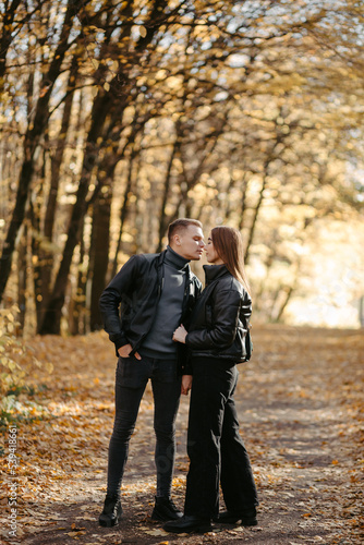 Lovely couple posing in autumn forest, lovers walking in park. lovestory in forest © andriyyavor