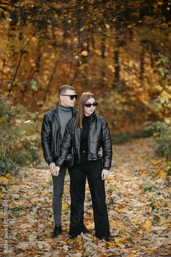 Lovely couple posing in autumn forest, lovers walking in park. lovestory in forest © andriyyavor