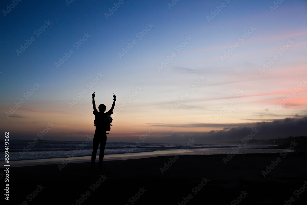 the silhouette of a person holding a finger the silhouette of a person holding a finger