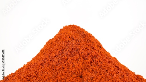 Chili pepper. Sprinkle ground chilli pepper or smoked paprika, white background