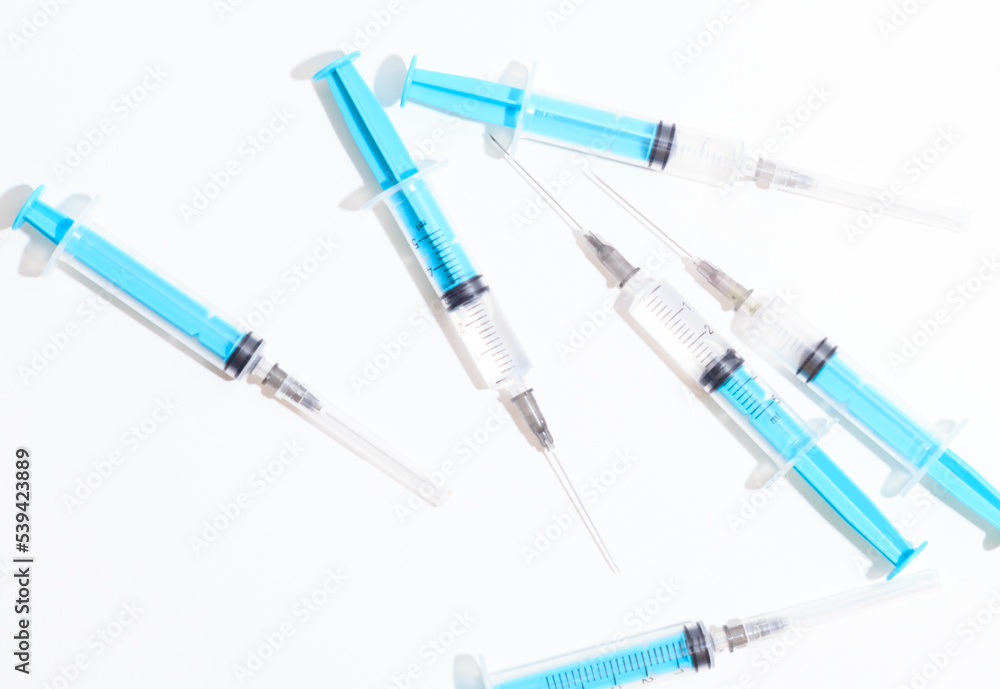 Disposable plastic syringe prepared for injection and vaccination in the hospital. The concept of medicine and health Disposable plastic syringe prepared for injection and vaccination in the hospital. The concept of medicine and health