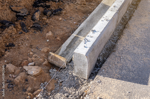 Canvas Print Concrete curbs installation works at road construction site