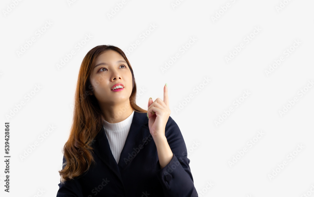 Businesswoman long hairstyle in black jacket looking up and finger pointing on white background.
Businesswoman long hairstyle in black jacket looking up and finger pointing on white background.