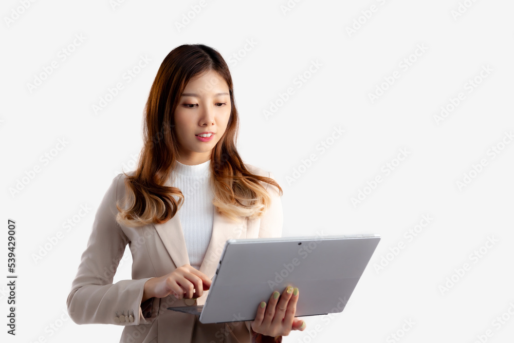 Asian pretty businesswoman holding notebook touching screen white background.
Asian pretty businesswoman holding notebook touching screen white background.