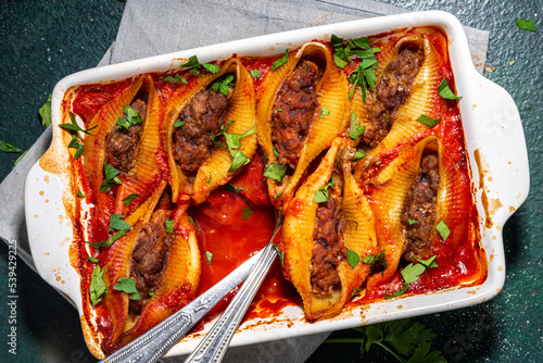 Photography Homemade pasta shells, italian conchiglioni stuffed with ground minced beef meat