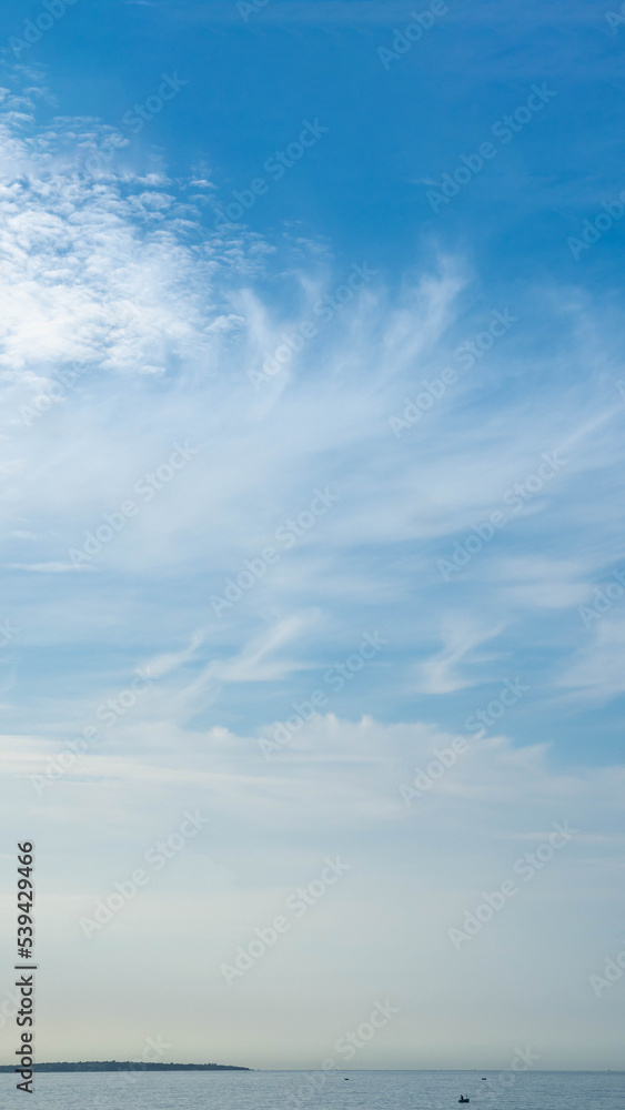 Obraz premium BANNER, VERTICAL STORY Atmosphere panorama white cloud clear blue sky horizon line calm empty sea. Concept paradise life. Design relax wallpaper background. More tone format in stock