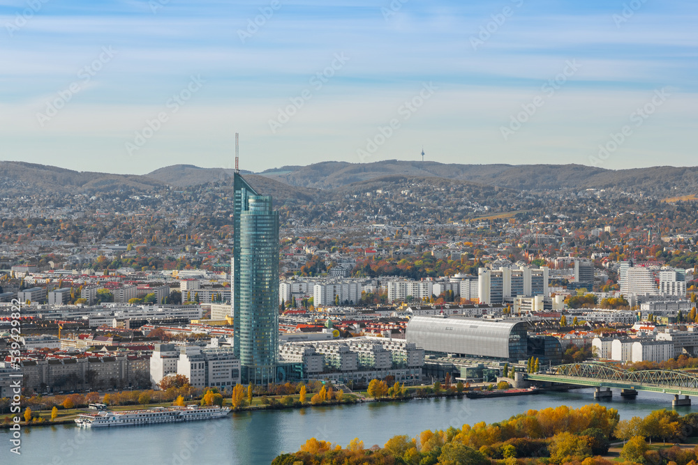 View across the river Danube with the Millennium Tower and Rivergate buildings at autumn in Vienna, Austria