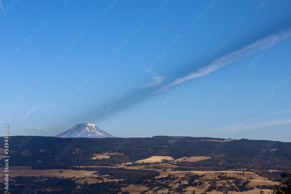 Mount Adams with a jet stream  above it